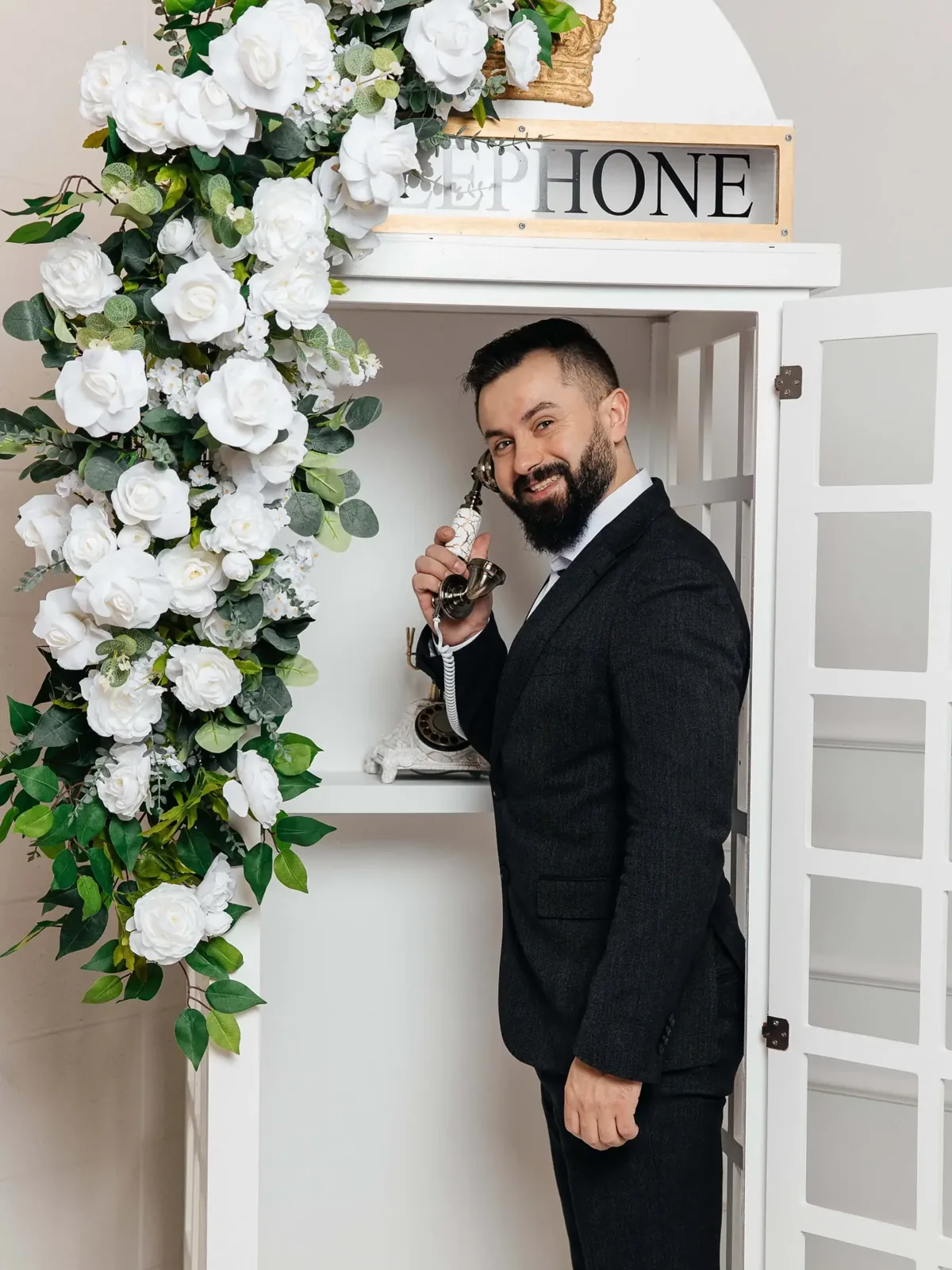 Guest leaving a voice message in the telephone booth audio guestbook