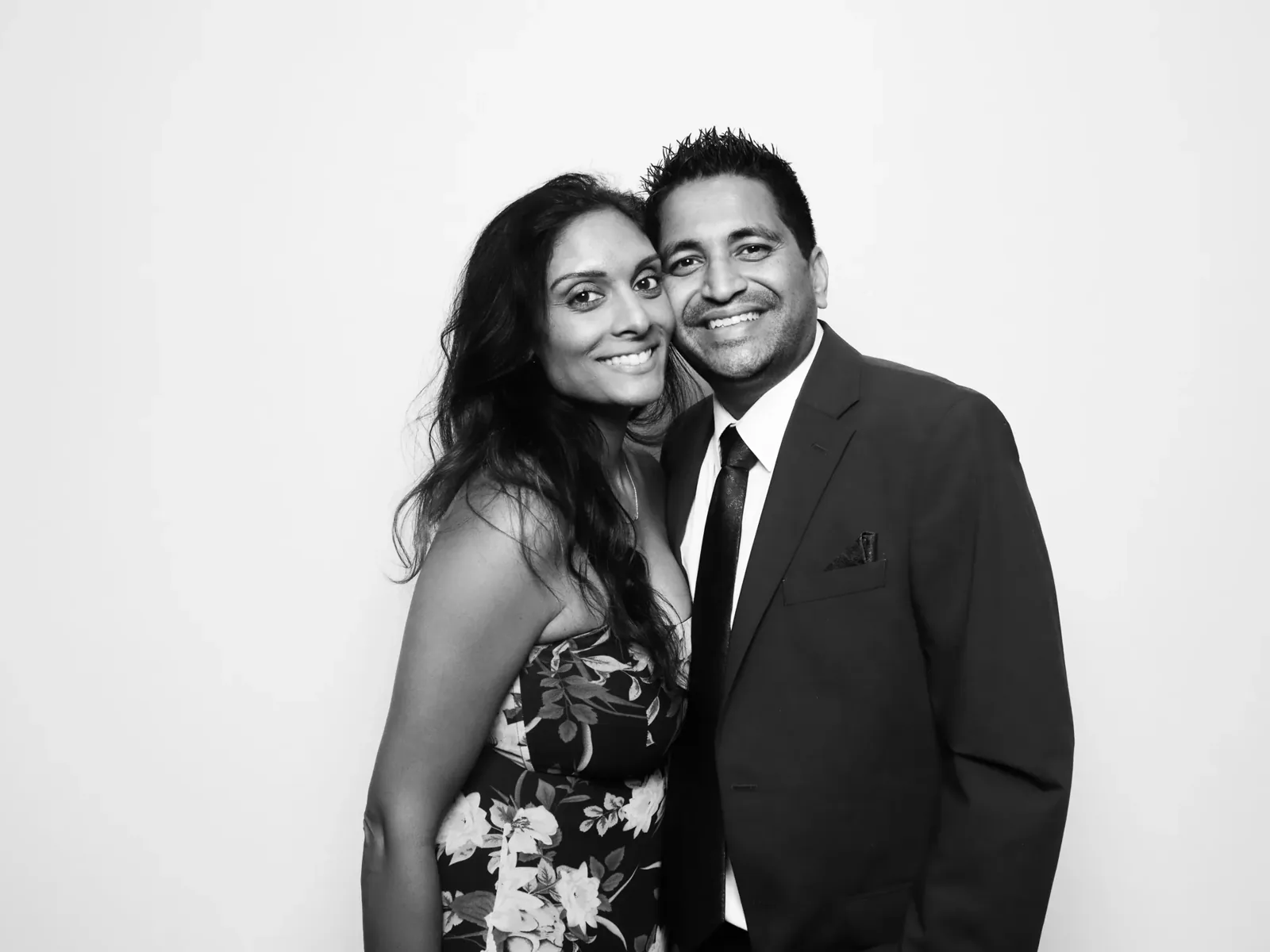 Smiling couple portrait from a black and white glam booth