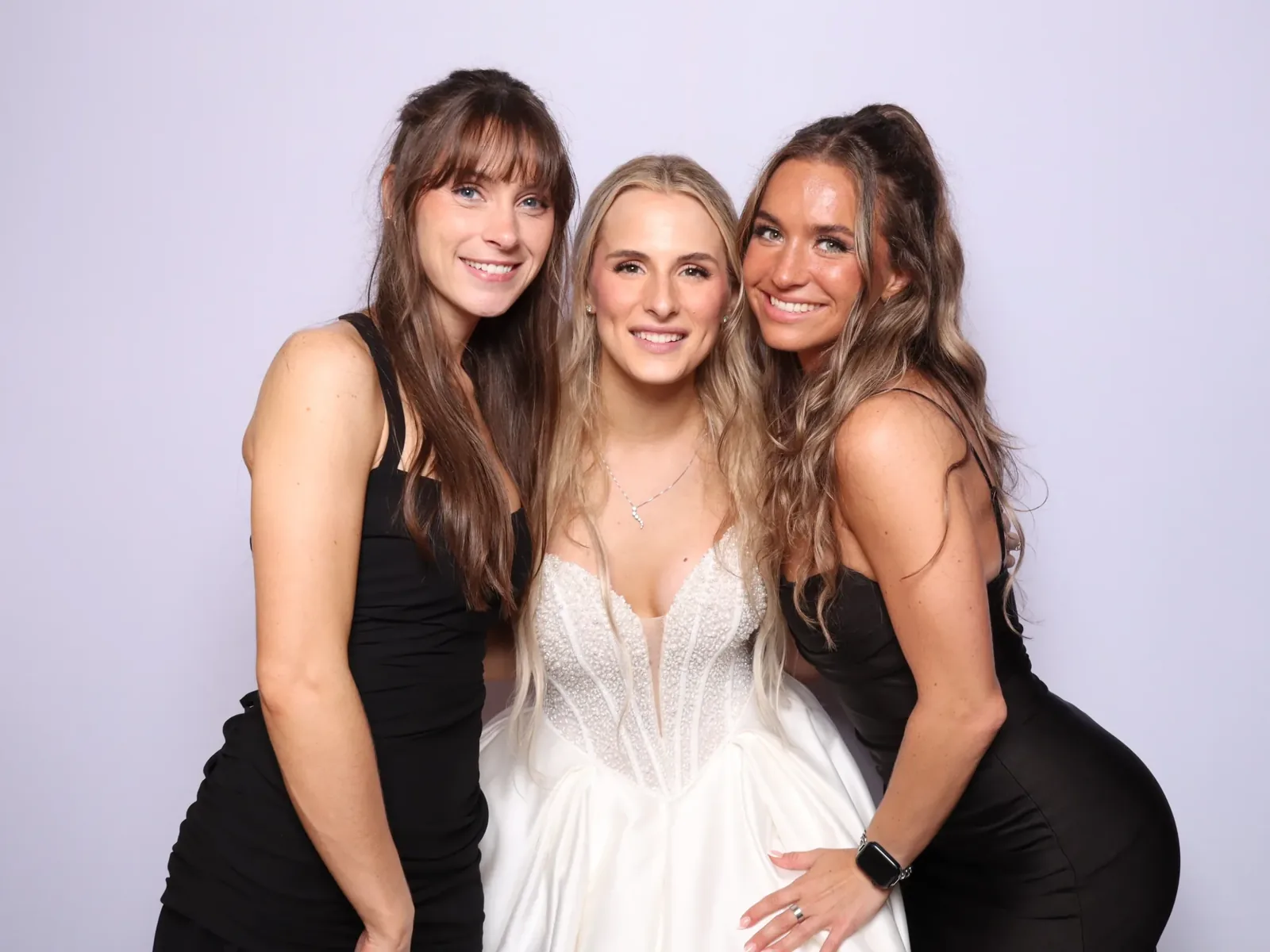 Bride with bridesmaids in a Chicago wedding photo booth