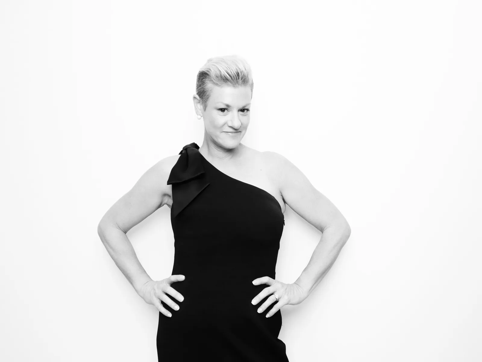 Guest in a one-shoulder evening gown in the black and white Glam photo booth in Chicago