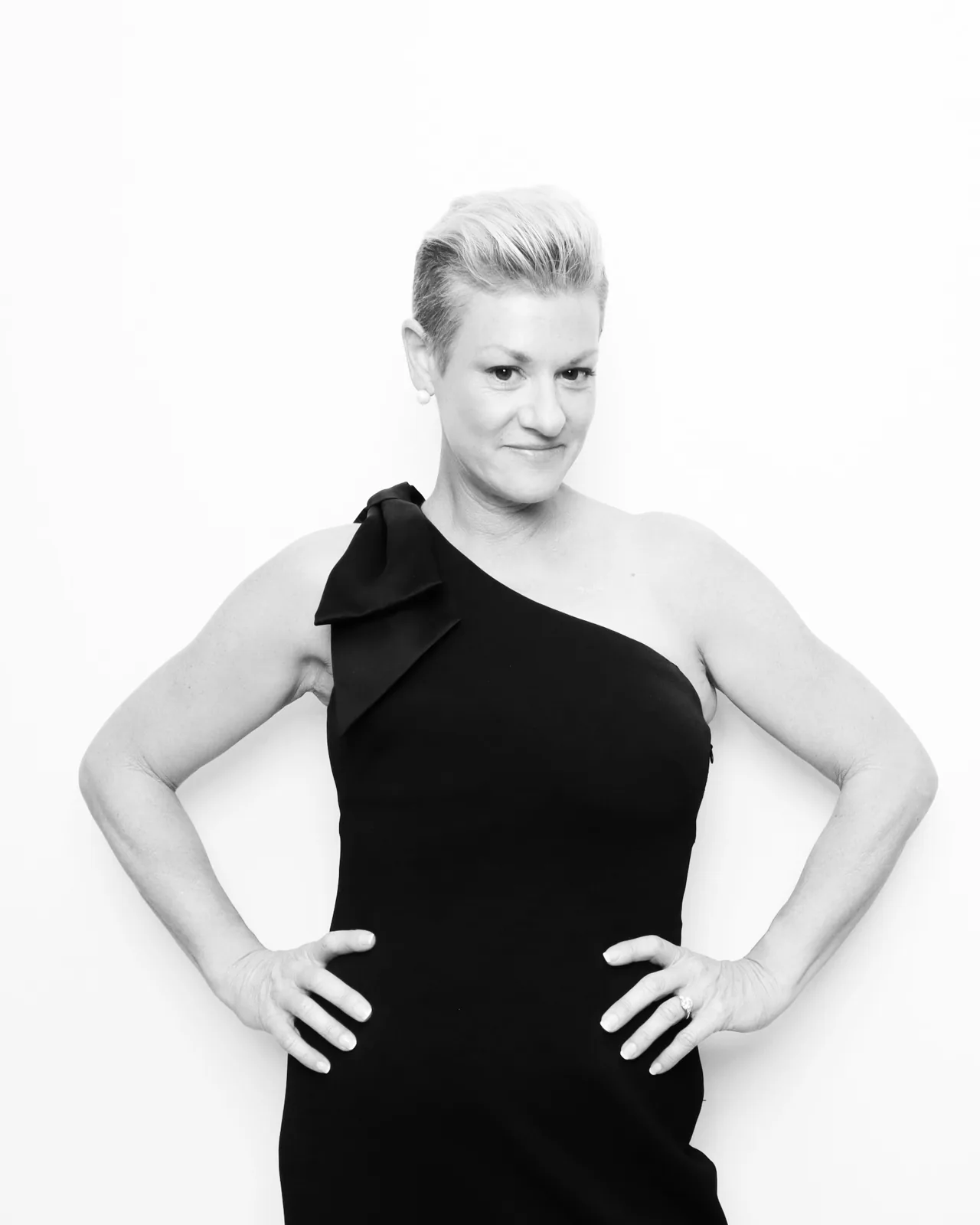 Guest in a one-shoulder evening gown in the black and white Glam photo booth in Chicago