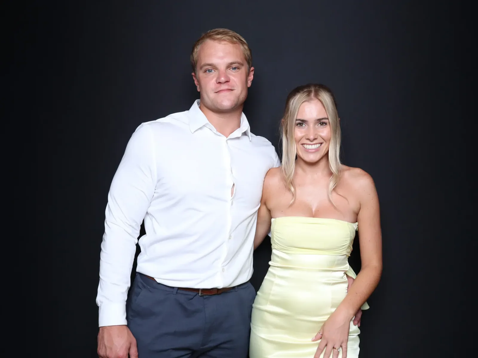 Couple portrait on the dark backdrop of the Luxe photo booth