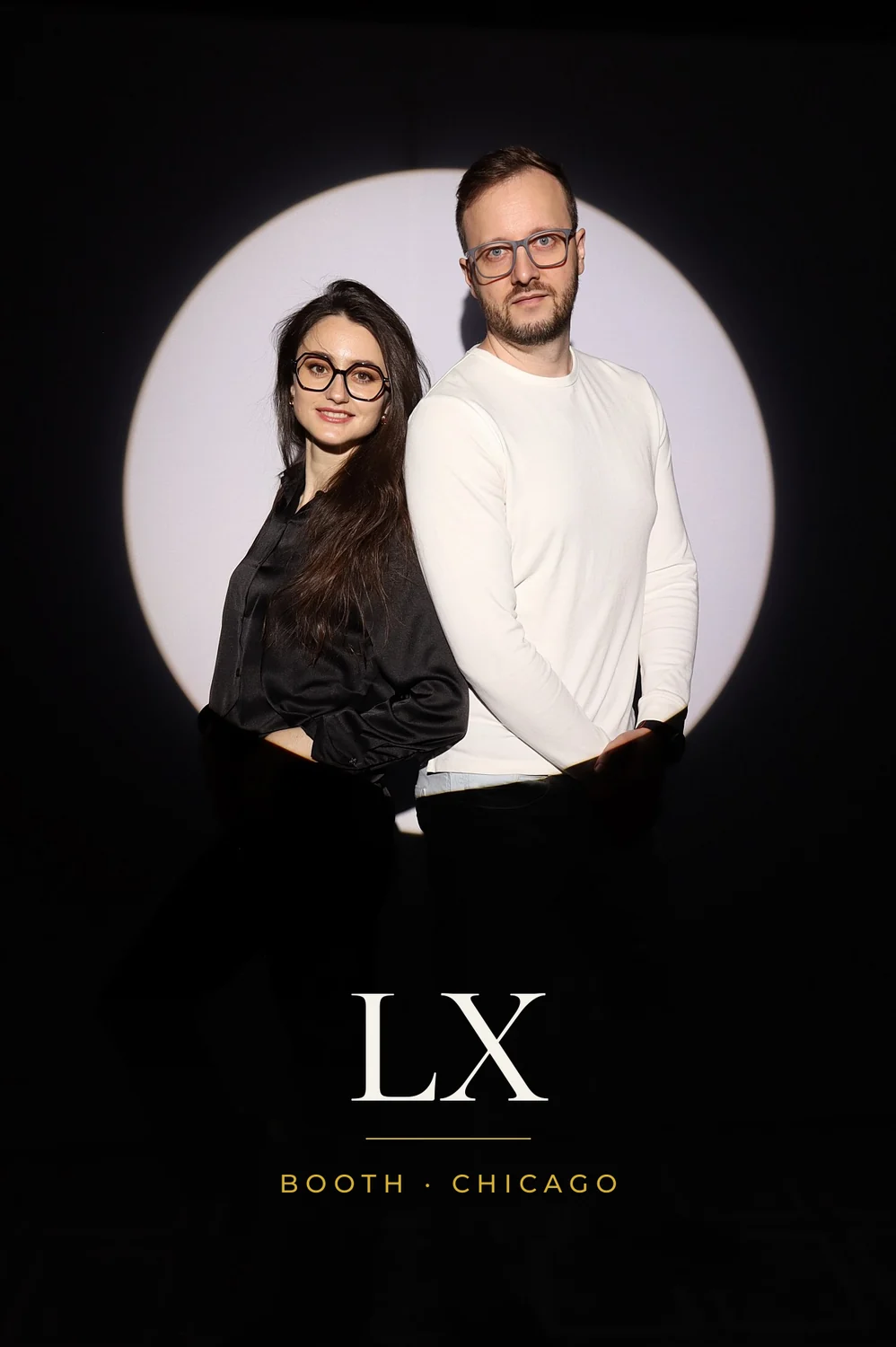 Couple in black and white outfits in the Spotlight photo booth in Chicago, 4x6 print