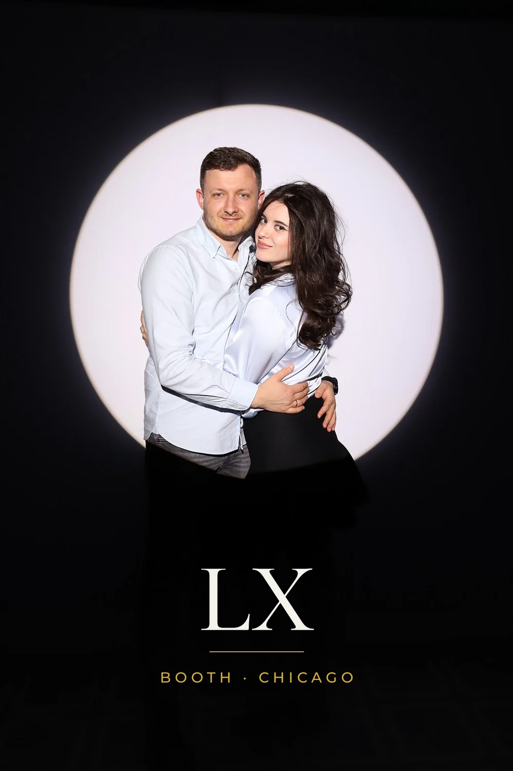Couple embracing in the Spotlight photo booth, 4x6 print