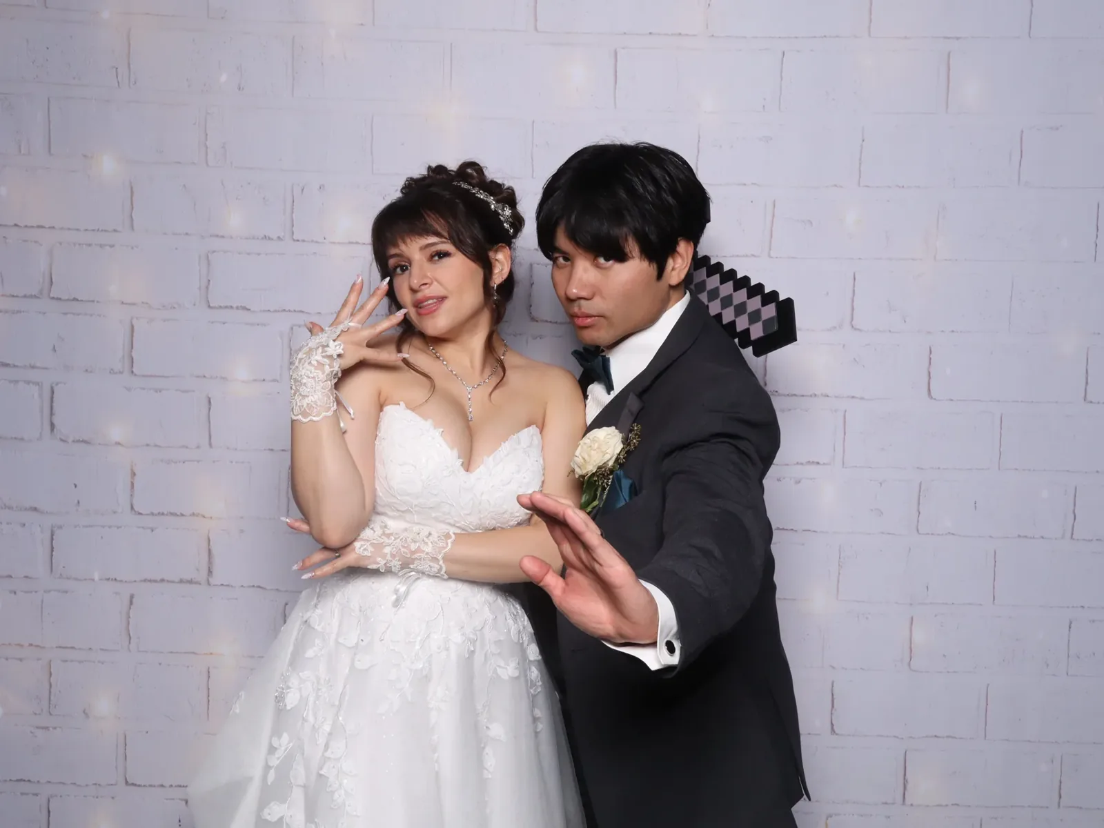 Bride and groom laughing in a wedding photo booth